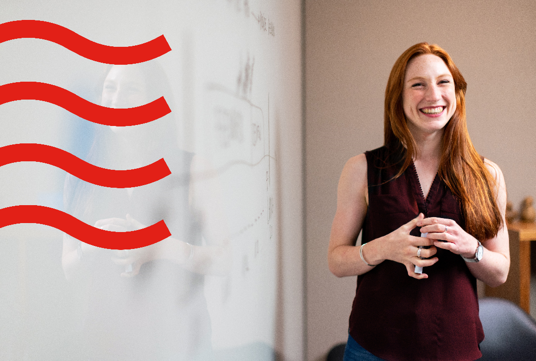 Lady in front of whiteboard