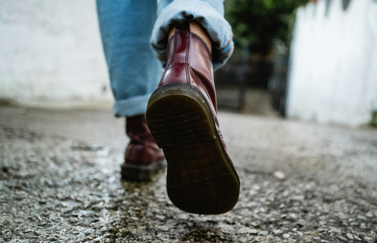 a man walking wearing boots