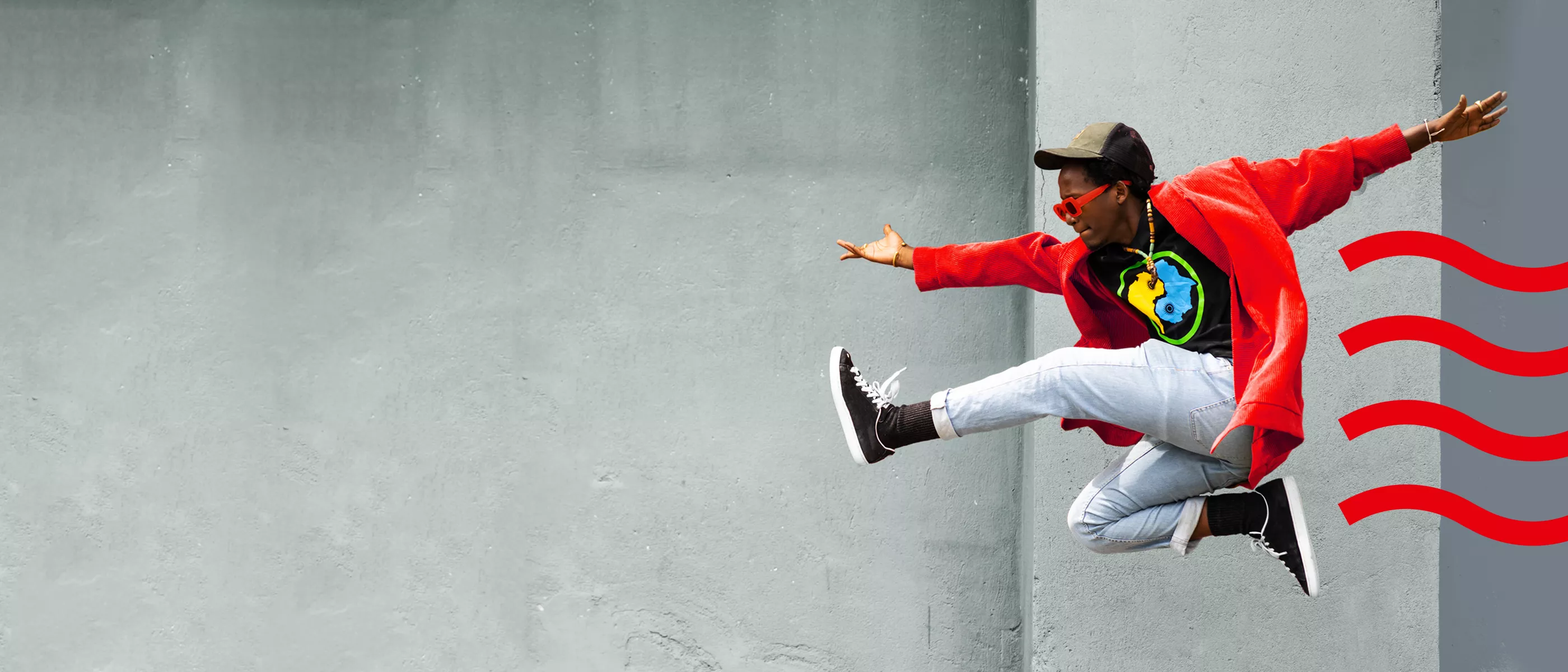 Man leaping in red hoodie