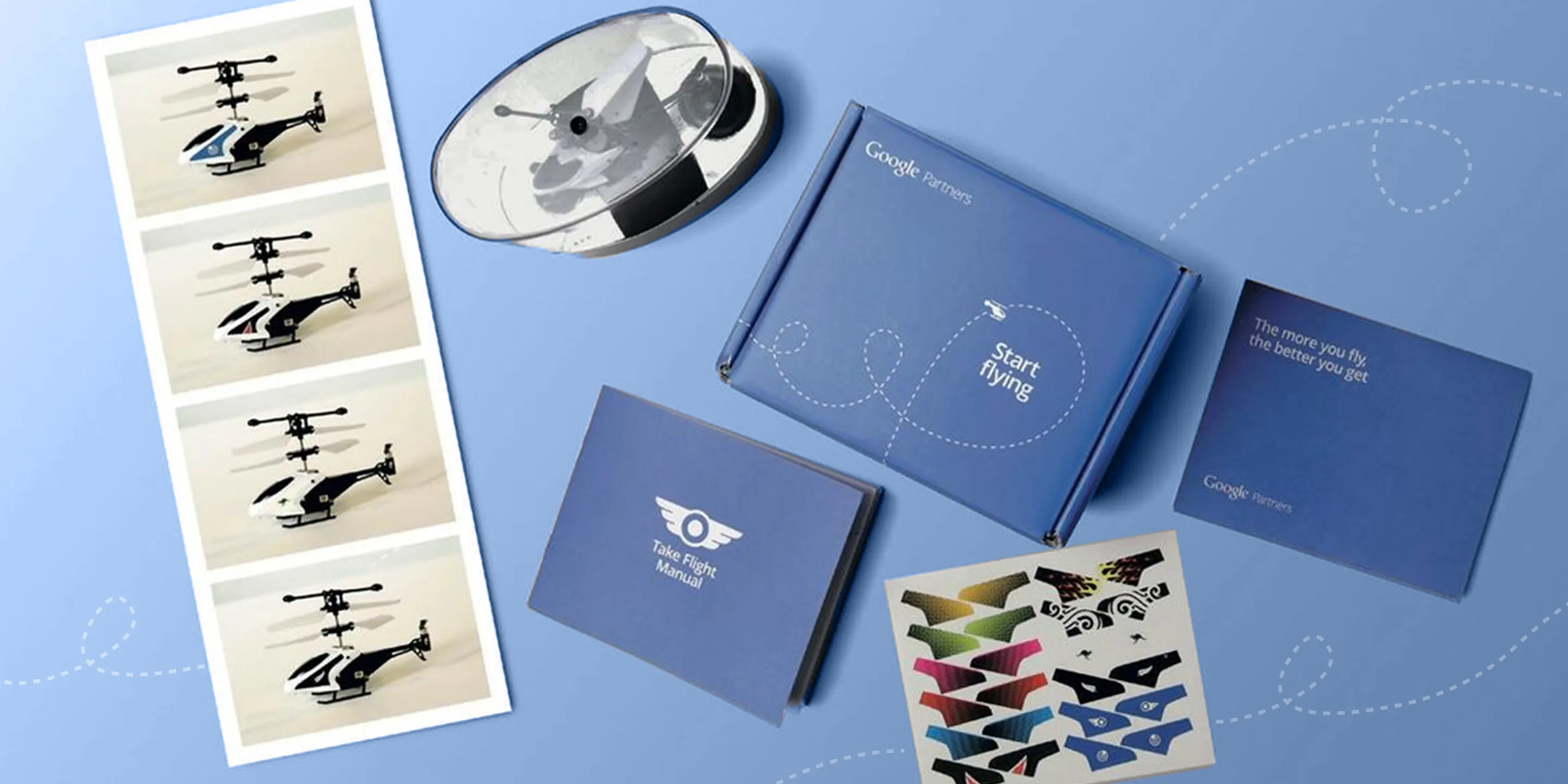 Google Partners kit with toy helicopter, boxes, manuals, and stickers